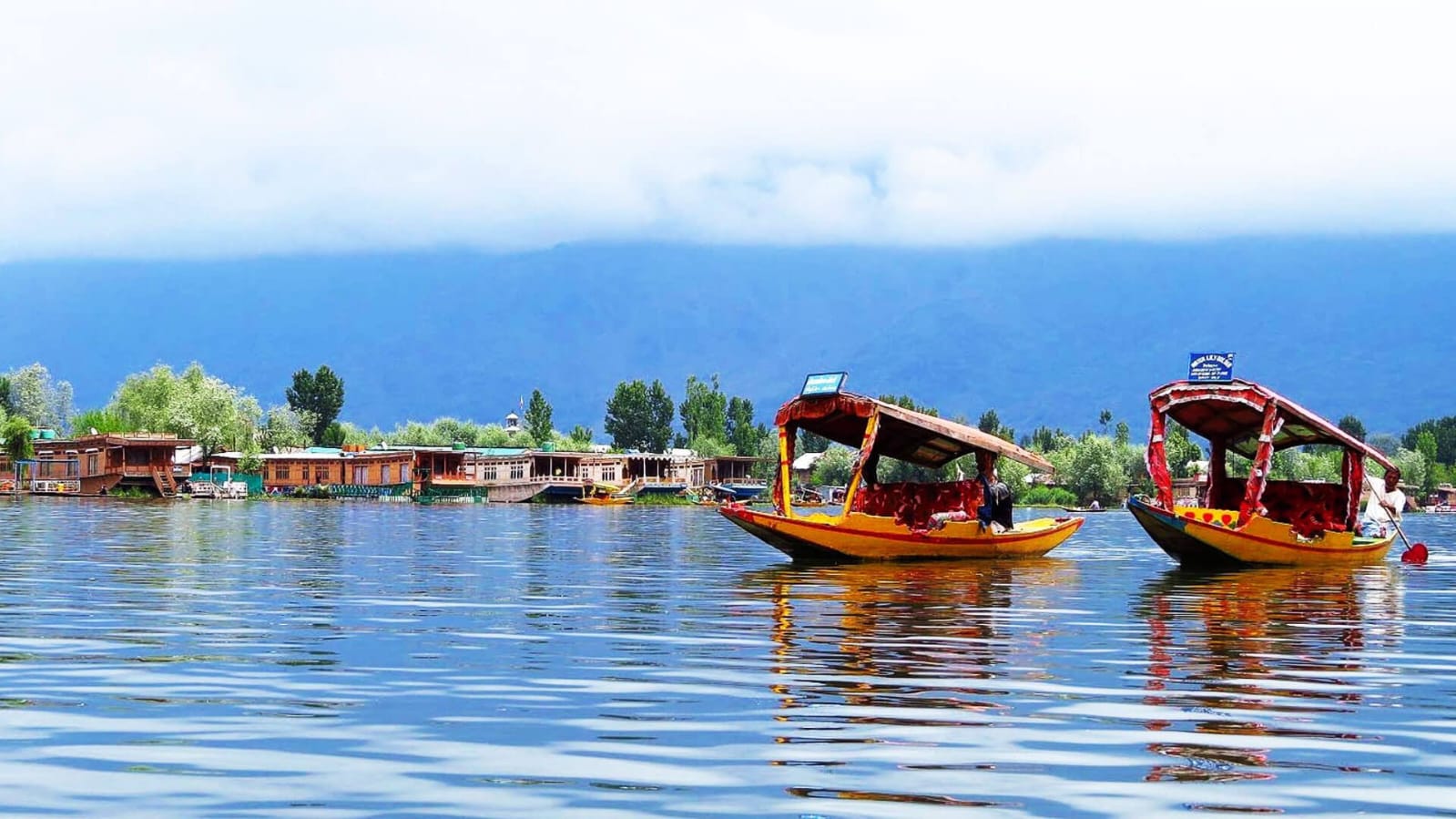 Muslim family enjoying Shikara ride in Kashmir - perfect Muslim-friendly tour activity