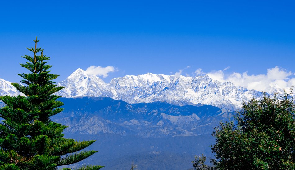 Muslim family enjoying panoramic Himalayan views on a Halal-friendly tour in Nainital