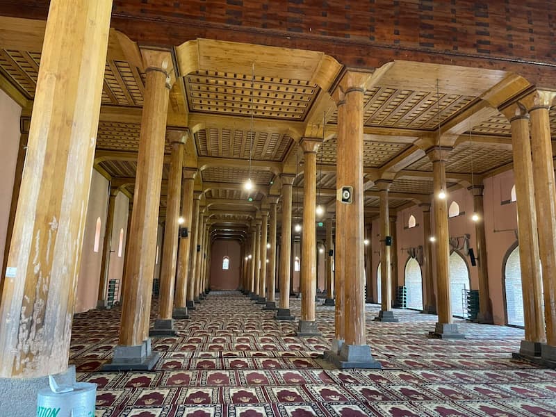 Intricate wooden interior of Jamia Masjid, Srinagar, reflecting Kashmir's Persian-influenced architecture