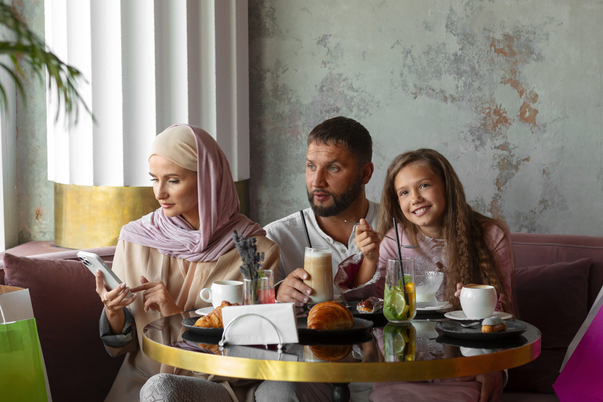A Muslim family happily enjoying a meal at a Halal-certified restaurant in India.