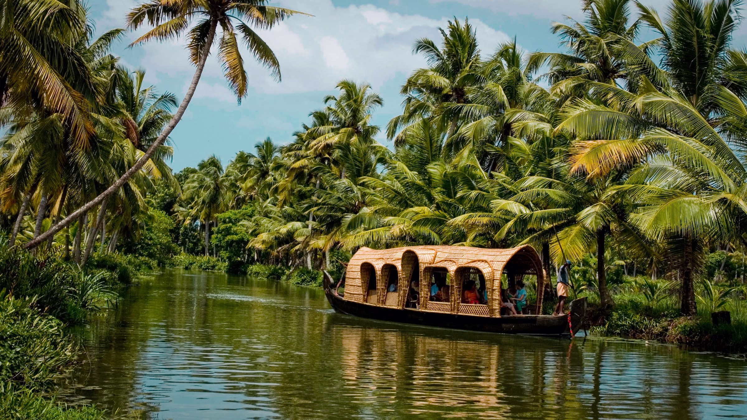 Muslim family enjoying boating on a scenic Kerala backwaters tour