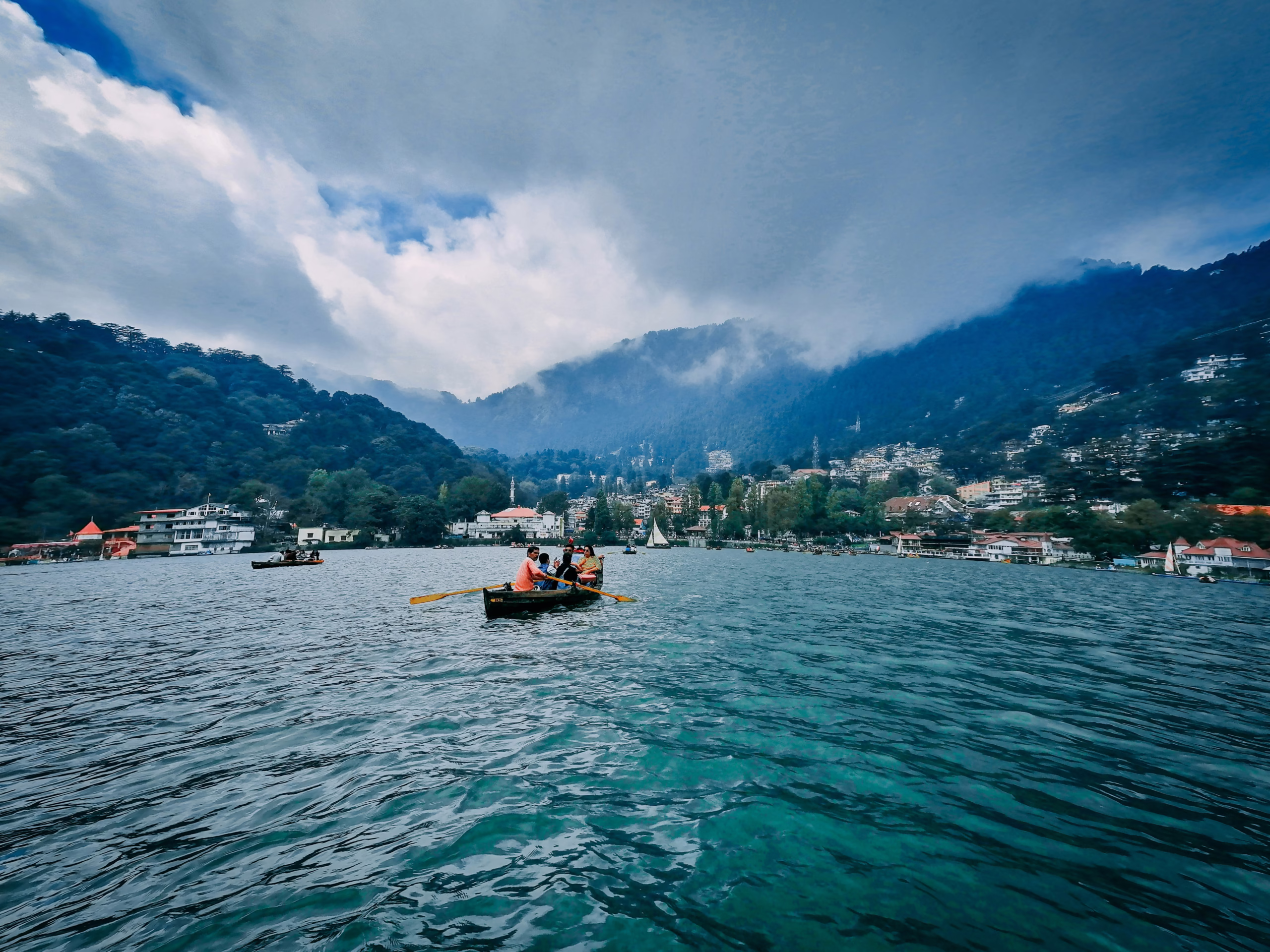 Muslim travelers enjoy boating at Naini Lake in Nainital