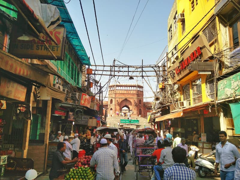 Muslim travelers visiting old Delhi market at Shahjahanabad near Jama Masjid