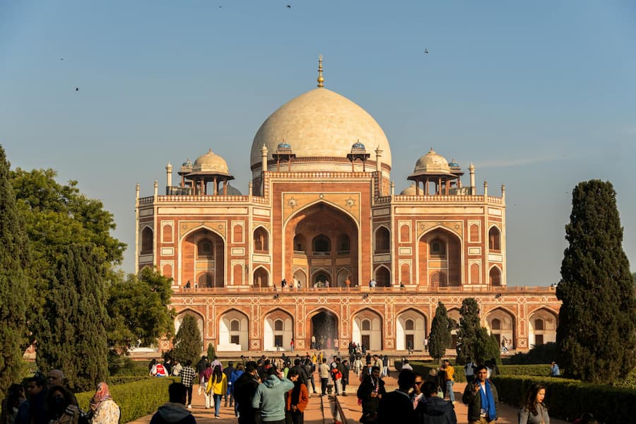 Muslim travelers visiting Humayun's Tomb, that inspired the Taj Mahal