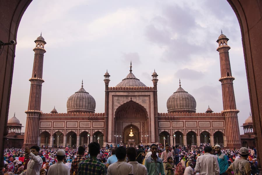 Muslim travelers visiting Jama Masjid, one of India's largest mosques, on the Golden Triangle tour