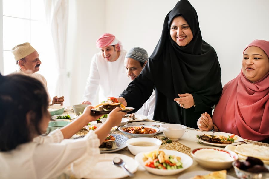 Muslim family enjoying Halal food during a Kerala Halal-friendly trip