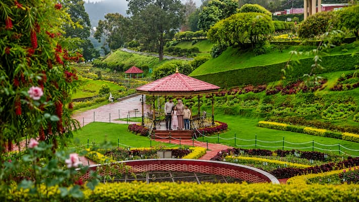 Muslim family exploring the Government Botanical Garden in Ooty