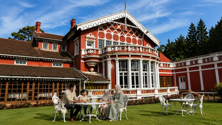 Muslim family exploring a Victorian-era British bungalow in Ooty, reflecting the town's colonial heritage