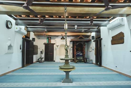 The traditional thatched wooden roof and centuries-old oil lamp preserved at Cheraman Juma Mosque, Kerala