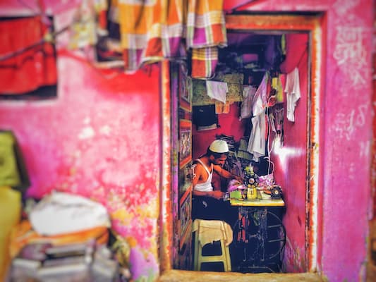 Muslim family exploring Dharavi's thriving small businesses on a guided community tour