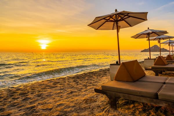 A stunning golden sunset over a Goa beach, perfect for a Halal-friendly honeymoon or family getaway