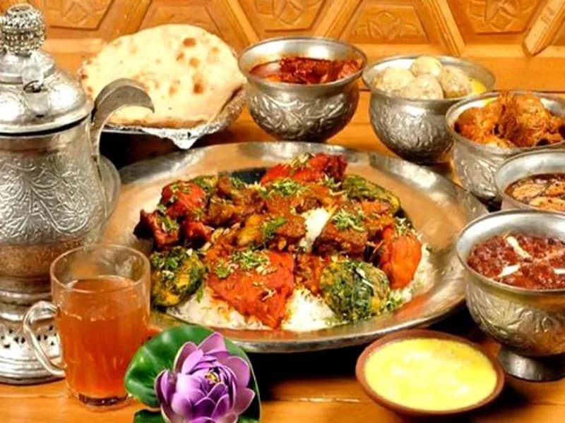 Traditional halal Wazwan feast served with saffron Kahwa tea