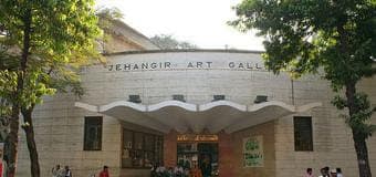 Muslim family exploring contemporary Indian art at Jehangir Art Gallery, Mumbai