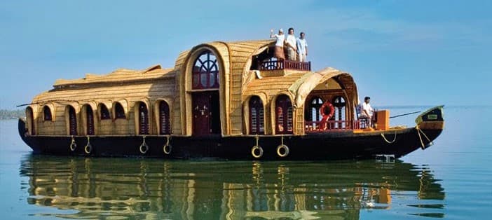 Muslim honeymoon couple enjoying Kerala Halal-friendly travel on a private houseboat cruise through the backwaters