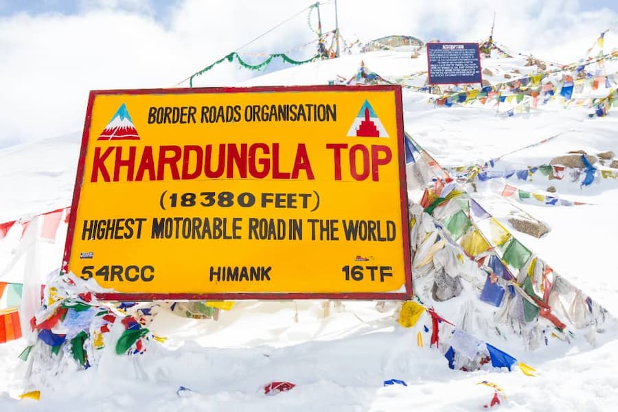 Muslim travelers exploring Khardung La Pass on a halal trip to Ladakh