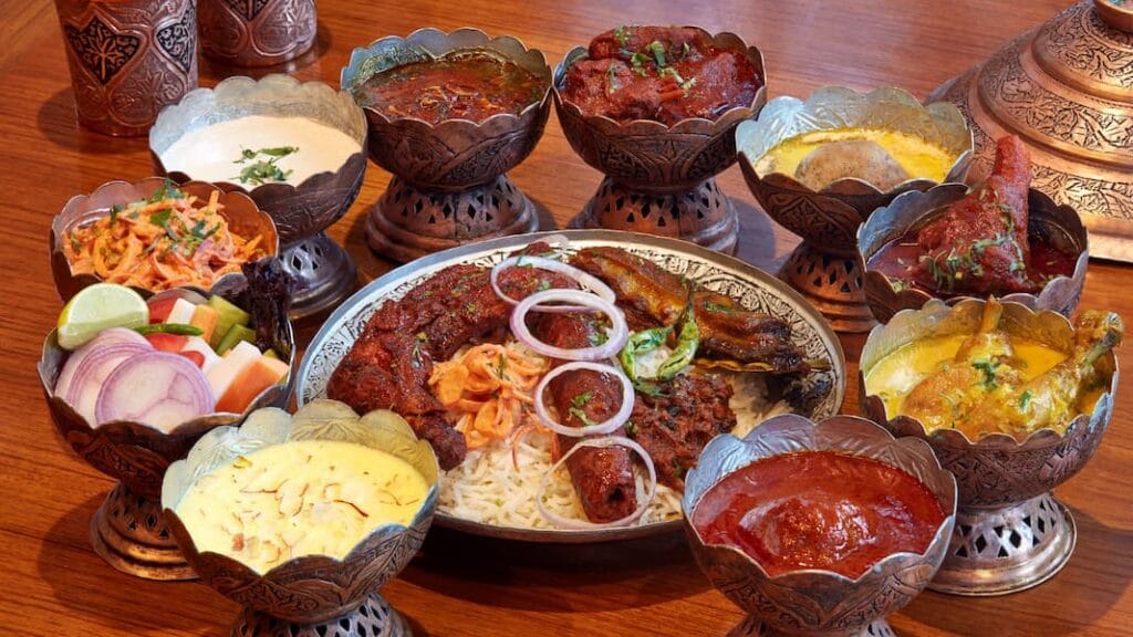 Muslim travelers enjoying Halal Kashmiri Wazwan food on a Halal trip to India