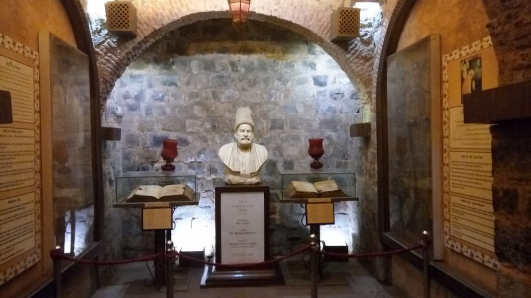 Period manuscripts and portraits inside the Mirza Ghalib Haveli museum, Old Delhi