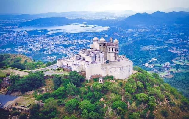 Muslim honeymoon couple watching the sunset from Udaipur's Monsoon Palace