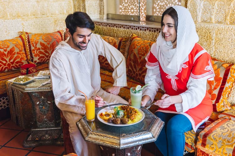 Muslim couple enjoying Halal food on a honeymoon trip in Munnar, Kerala