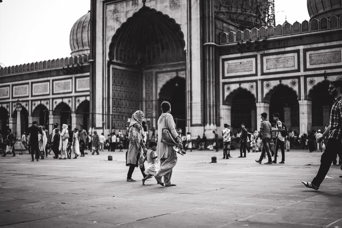 Muslim family exploring the historic Jama Masjid of Old Delhi's Shahjahanabad Mughal walled city on a Delhi Islamic heritage tour