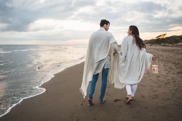 Muslim honeymoon couple enjoying a romantic getaway at a Goa beach