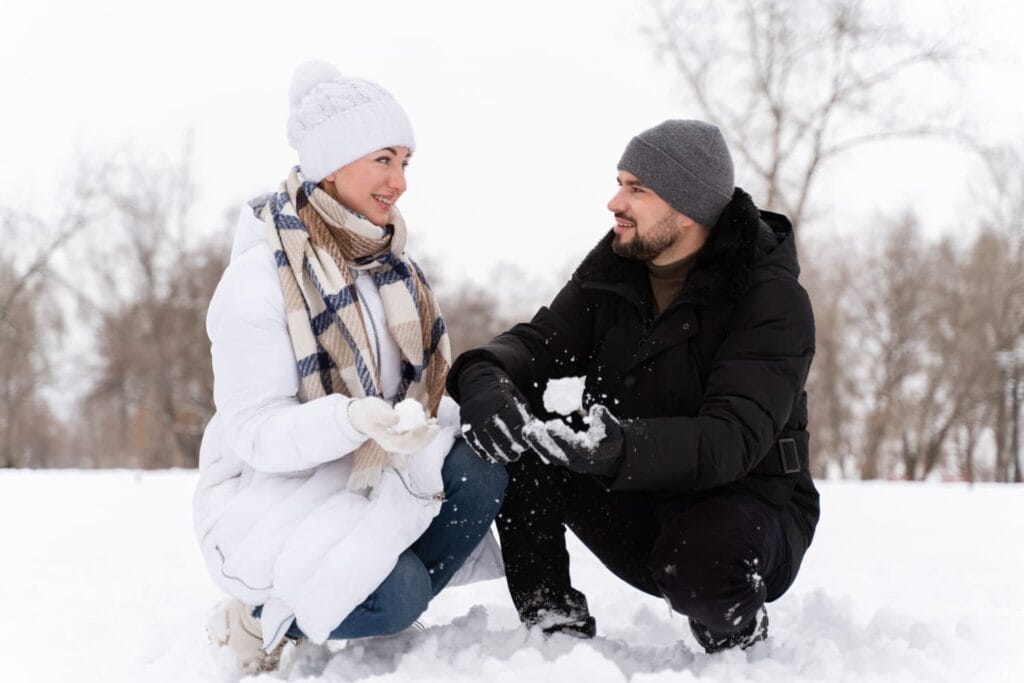 Muslim honeymoon couple enjoying snowy landscapes at Rohtang Pass, Manali