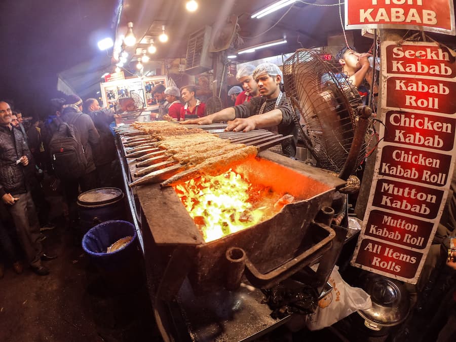 Muslim travelers enjoying halal kebab and biryani during a Halal-friendly trip to India