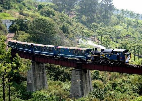 Muslim family riding the UNESCO-listed Nilgiri Mountain Railway toy train in Ooty