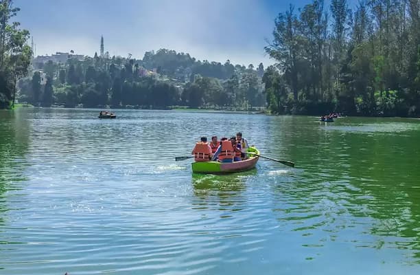 Muslim honeymoon couple enjoying a peaceful boat ride on Ooty Lake