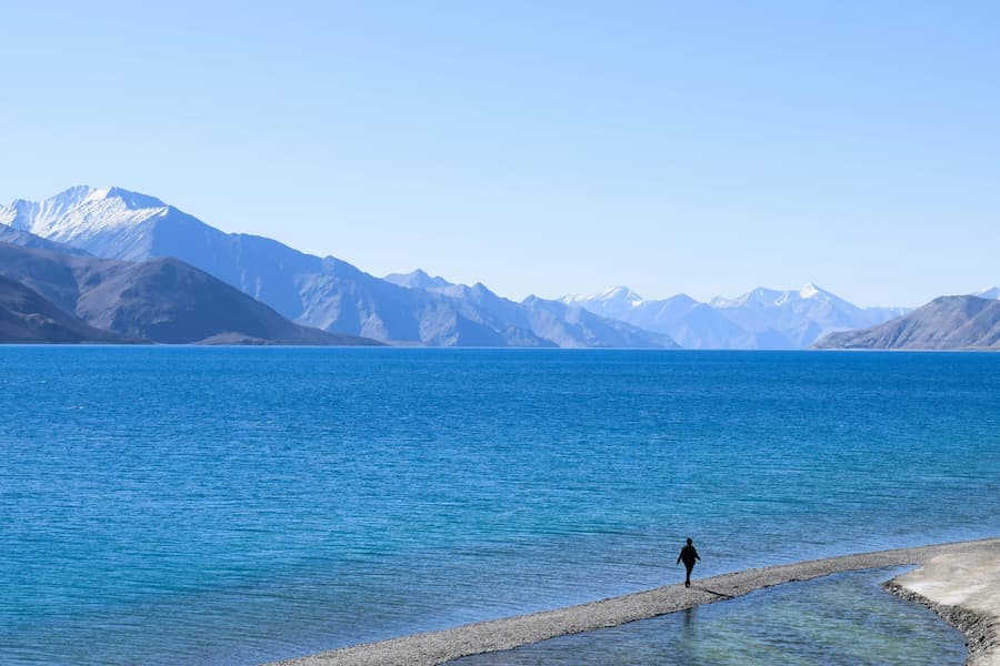 Muslim travelers exploring Pangong Lake on a halal trip to Ladakh