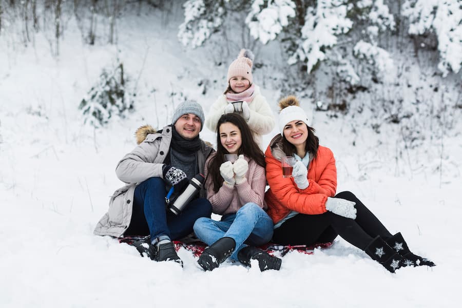 Muslim family enjoying snow activities at Rohtang Pass near Manali