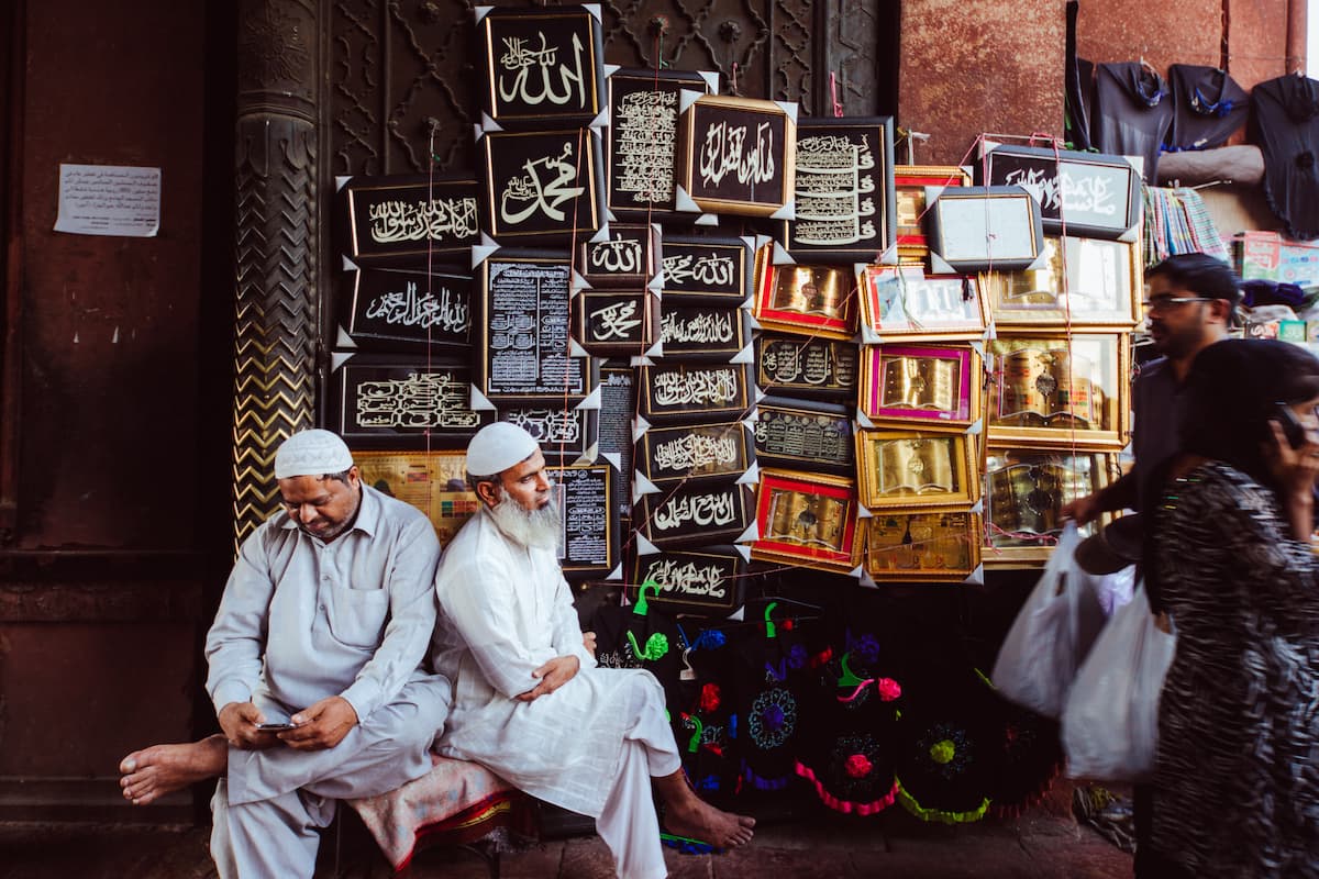Muslim family walking through the narrow historic lanes of Shahjahanabad, Old Delhi