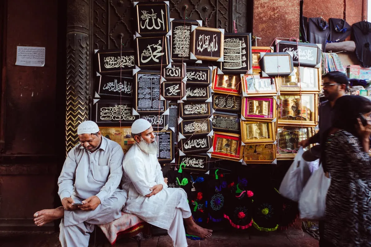 Muslim family walking through the narrow historic lanes of Shahjahanabad, Old Delhi