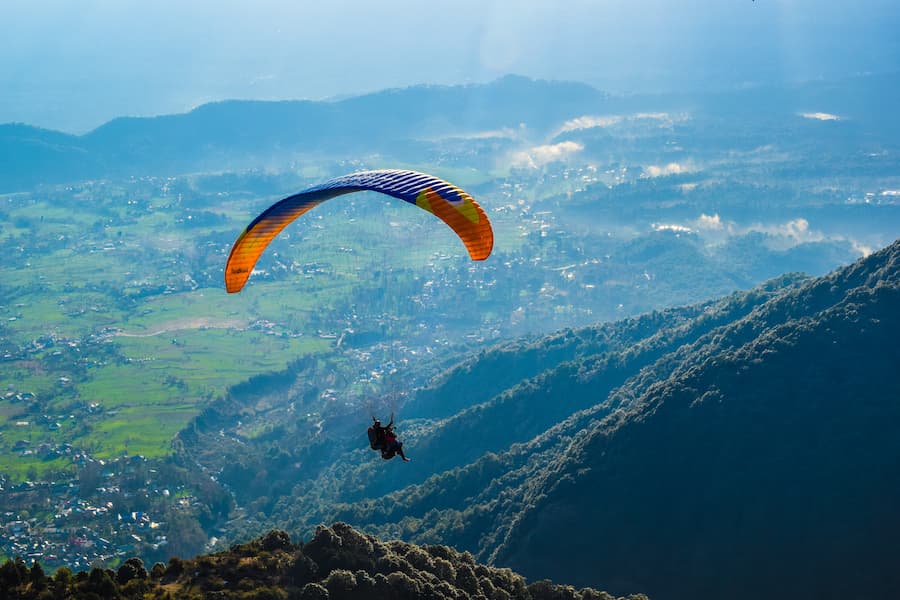 Muslim family enjoying paragliding adventure in Solang Valley, Manali