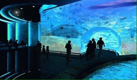 Muslim family exploring Taraporewala Aquarium, India's oldest aquarium, in Mumbai