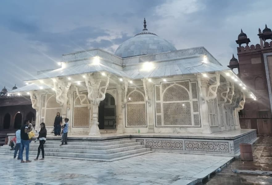 Muslim pilgrims visiting a historic dargah on a Ziyarat tour across India
