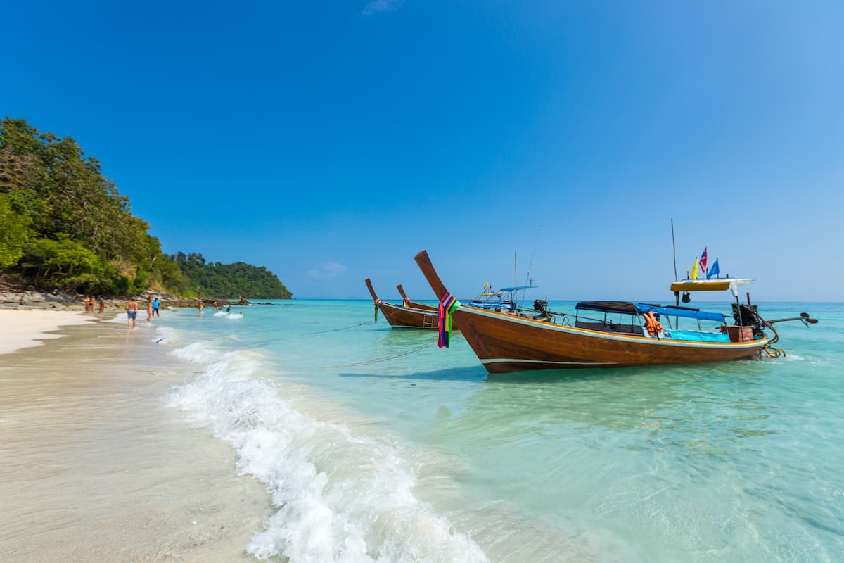 Muslim couple walking along Radhanagar Beach, Andaman Islands
