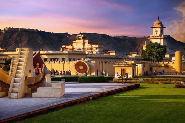 Jantar Mantar's astronomical instruments beside Jaipur's royal City Palace