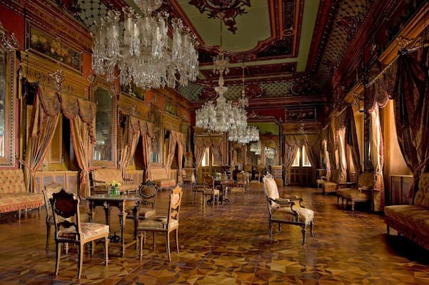 Falaknuma Palace's opulent interiors, a landmark of Muslim-friendly tours in Hyderabad