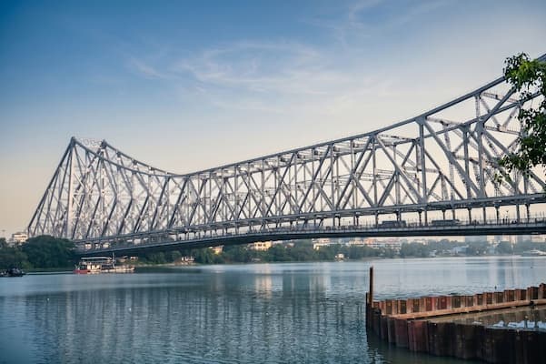 Muslim family viewing the iconic Howrah Bridge in Kolkata