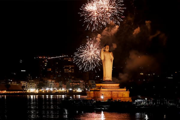 The illuminated Buddha statue on Hussain Sagar Lake at night, a striking sight in Hyderabad City of Nizams