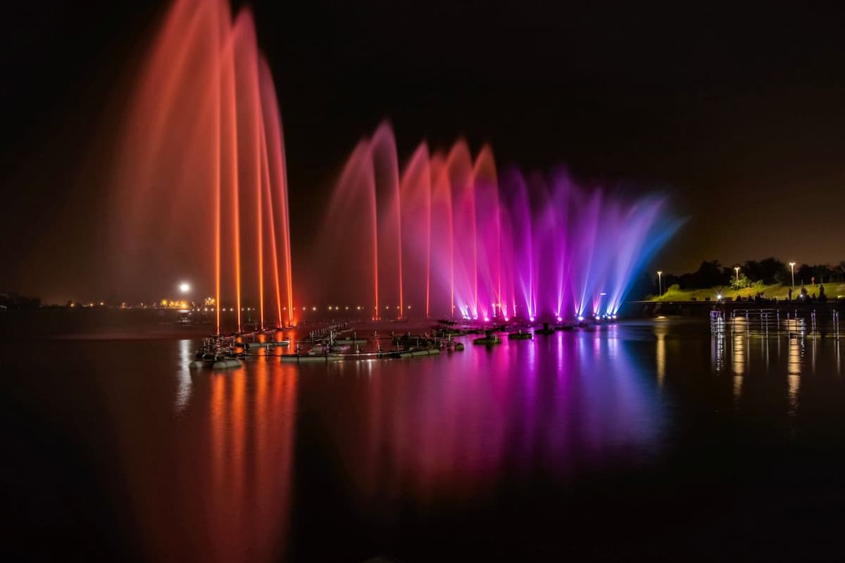 Hussain Sagar Lake illuminated in the evening, a popular spot for Halal-friendly tours in Hyderabad