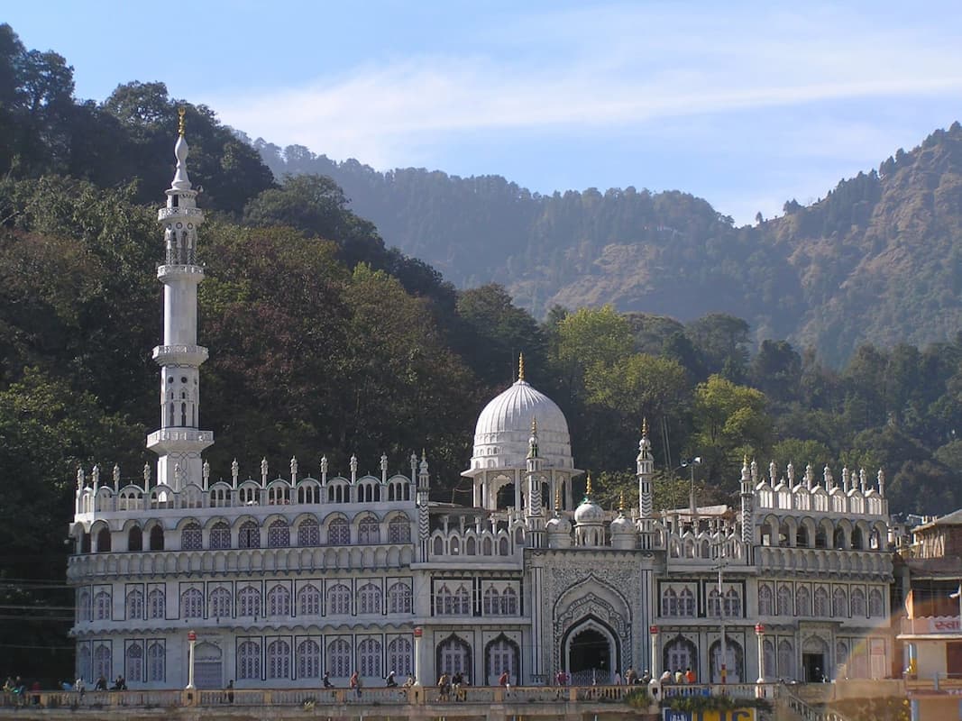 Muslim travelers visiting Jama Masjid, a historic Indo-Islamic mosque in Nainital