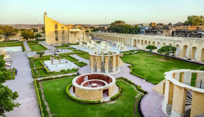 Muslim travelers exploring Jantar Mantar's historic astronomical instruments in Jaipur