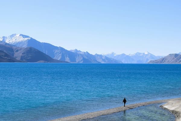 Muslim family admiring the turquoise waters of Pangong Lake, Ladakh