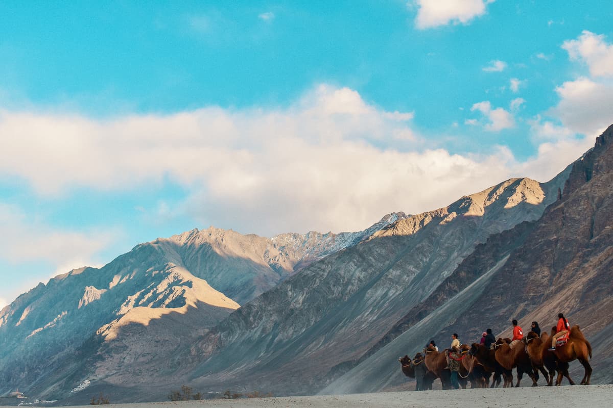 Muslim couple exploring the sand dunes of Nubra Valley, Ladakh