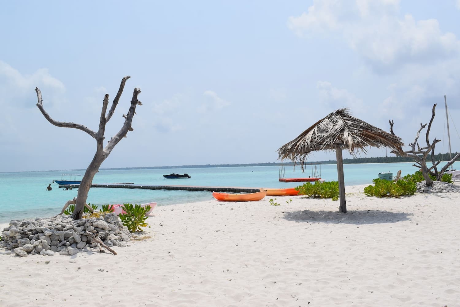 Muslim honeymoon couple relaxing on a secluded private beach in Lakshadweep