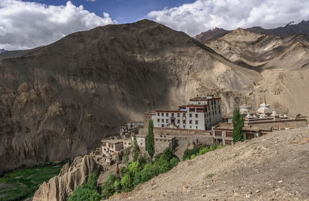 Muslim family visiting Lamayuru Monastery, known for its moon-like landscape