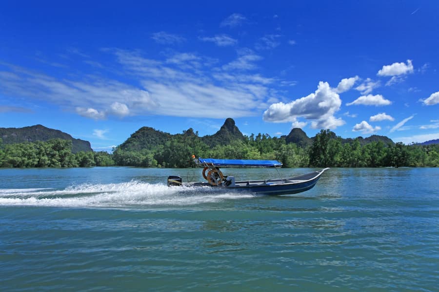 Muslim family on a boat ride through mangrove creeks to Baratang Island, Andaman