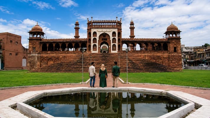Muslim family visiting Moti Masjid, known for its pearl-white marble and resemblance to Delhi's Jama Masjid